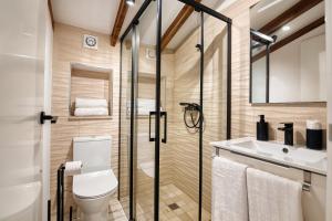 a bathroom with a toilet and a sink at Mirasol in Benitachell +15 photos
