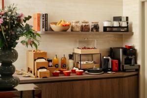 a kitchen with a counter with food on it at Jills Hôtel in Paris