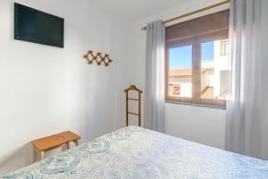 Un pat sau paturi într-o cameră la Casa Margarida Malveiro