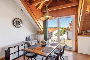 a kitchen and dining room with a table and chairs at Appartement Männerleben in Harztor
