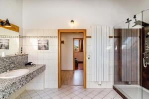 a bathroom with a shower and a sink at Appartement Männerleben in Harztor +27 photos