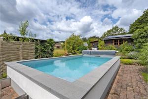 a swimming pool in the backyard of a house at Ferienwohnung Selbecke in Kirchhundem
