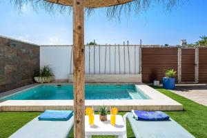 a swimming pool in the backyard of a house at Casa Orilla Sur A in El Palmar