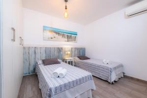 a room with two beds in a room at Casa Cantino in Santa Margalida +22 photos
