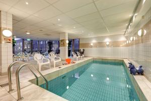 a swimming pool in a hotel room with a swimming pool at Scandic Linköping Väst in Linköping