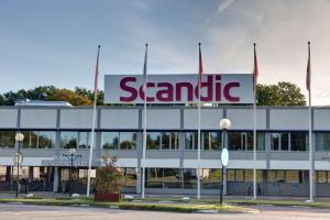a large building with a senna sign on it at Scandic Linköping Väst in Linköping