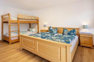 a bedroom with two bunk beds and a ladder at Beim Blitz ehemals Haus Maier in Schwangau