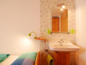 a bathroom with a sink and a mirror at Haus Trötschler in Weilheim +35 photos