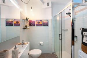 a bathroom with a toilet and a shower at Olas del Atlántico in Tacoronte +18 photos