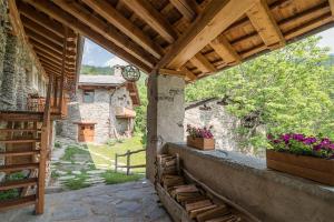 an outside view of a house with a wooden roof at Civico 7 in Marmora +4 photos