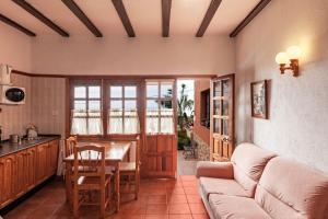 a living room with a couch and a table at Casa Victor - Apartment 3 in La Orotava