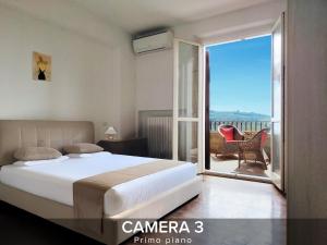 a bedroom with a large bed and a balcony at Villa Gelsi a Pesaro in Pesaro +37 photos