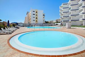 a large swimming pool in the middle of a building at Tamaran Bureba 511 in Maspalomas