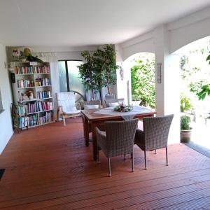 a dining room with a wooden table and chairs at Eifelstube Langerwehe in Langerwehe