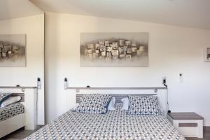 a bedroom with a bed with two pillows at Lucerta Bella in Aix-en-Provence +15 photos
