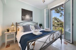 a bedroom with a bed with towels on it at Villa Iconi Lake Garda in Manerba del Garda