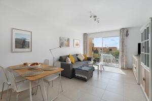 a living room with a couch and a table at casa agua y sol 2 in Poris de Abona