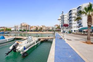 a boat docked at a dock in a marina at Vora Port in L'Ampolla
