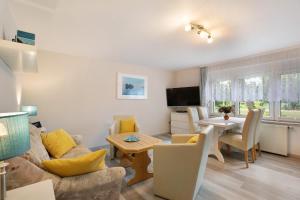 a living room with a couch and a table at Ferienwohnung Shaun in Blankenburg