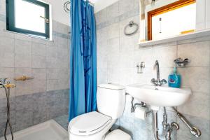 a bathroom with a toilet and a sink at Daratos studio 1 in Kefallonia