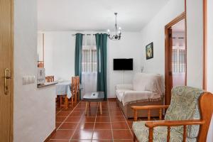 a living room with a couch and a chair at Casa Antonia 2 in Conil de la Frontera