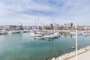 a bunch of boats are docked in a harbor at Bonanza in Gandía
