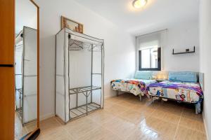 a bedroom with a bed and a mirror at Casa Roc De Sant Gaietà in Roda de Bará +15 photos