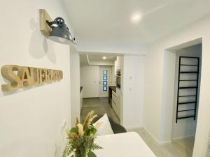a kitchen and dining room with white walls and a table at Ferienwohnung Nele in Plettenberg