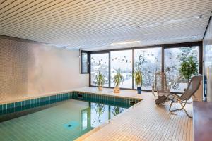 a pool in a house with a swimming pool at Schwarzwaldblick F App 3 mit Pool in Schönwald