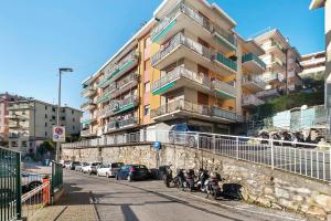 a row of motorcycles parked in front of a building at Maison Giovanna with garage parking in Rapallo