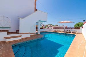 a swimming pool in the middle of a villa at Santa Brígida in Cala en Porter