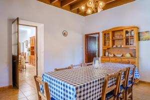 a dining room with a table and some chairs at Can Consul in San Juan Bautista