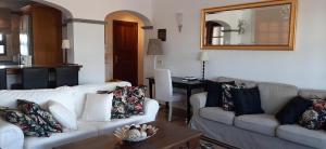 a living room with two couches and a table at Villa Adais in Playa Blanca +21 photos