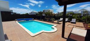a swimming pool on top of a house at Villa Adais in Playa Blanca