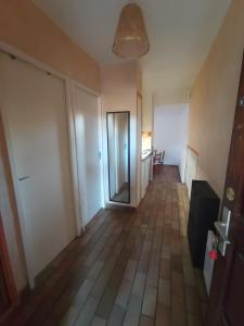 an empty hallway with a door and a room at Gîte Capibay Les Herbes de Provence in Six-Fours-les-Plages