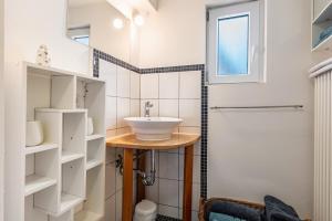 a bathroom with a sink and a shower at Fachwerkhaus Für Dich in Eberbach +19 photos