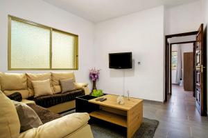 a living room with a couch and a coffee table at Pico The Best View in Ribeira Brava