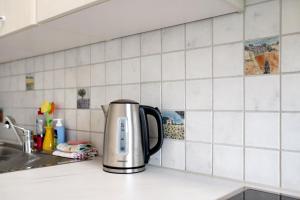 a coffeemaker sitting on a counter in a kitchen at Ado Ferienwohnung in Grafenhausen