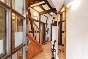 a hallway of a house with a wooden door at Traumschlüsselchen in Braubach