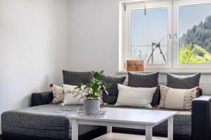 a living room with a couch and a table at Haus Albi in Waldkirch