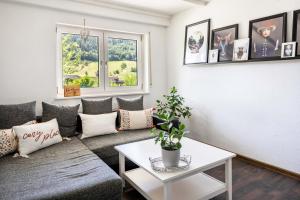 a living room with a couch and a table at Haus Albi in Waldkirch