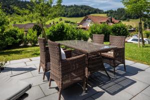 a patio table and chairs on a patio at Haus Albi in Waldkirch