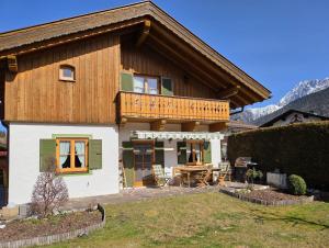 a house with a deck on top of it at Bletschers Hoamat in Mittenwald