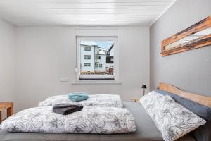 a bedroom with a bed and a window at Auszeit Schwarzwald in Furtwangen