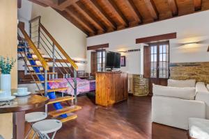 a living room with a loft bed and a staircase at C de Alborada del eo in Villameitide
