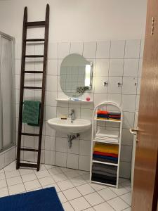 a bathroom with a sink and a mirror at Auf dem Karlsberg in Weilburg +61 photos