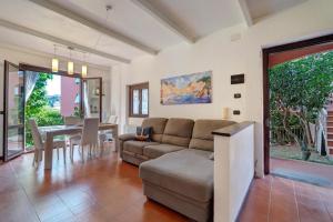 a living room with a couch and a table at Casa Sole e Mare in Arenzano