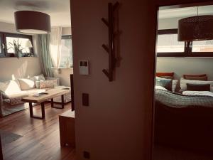 a living room with a couch and a table at Zone 3 in Erfurt