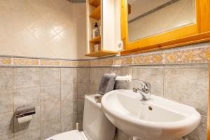 a bathroom with a sink and a toilet at Sa Torre in Port de Soller