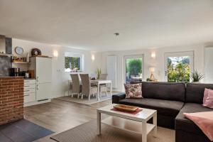 a living room with a couch and a table at Ferienwohnung Gabler in Möhnesee